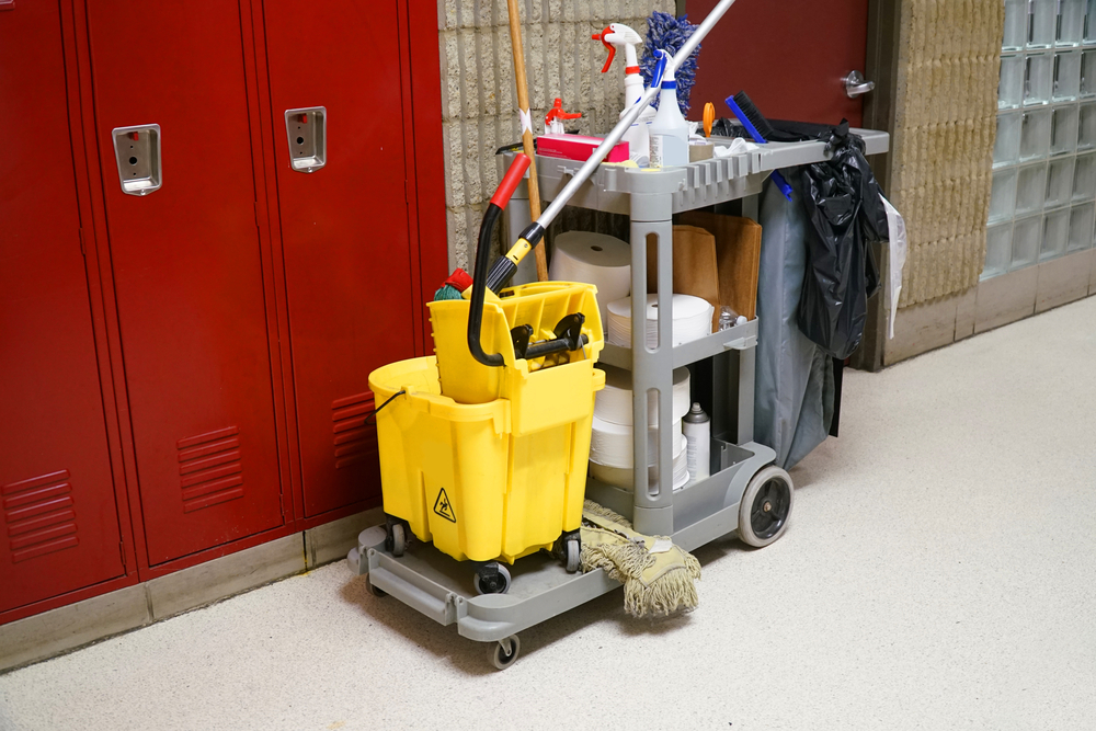 School cleaning cart by student lockers.